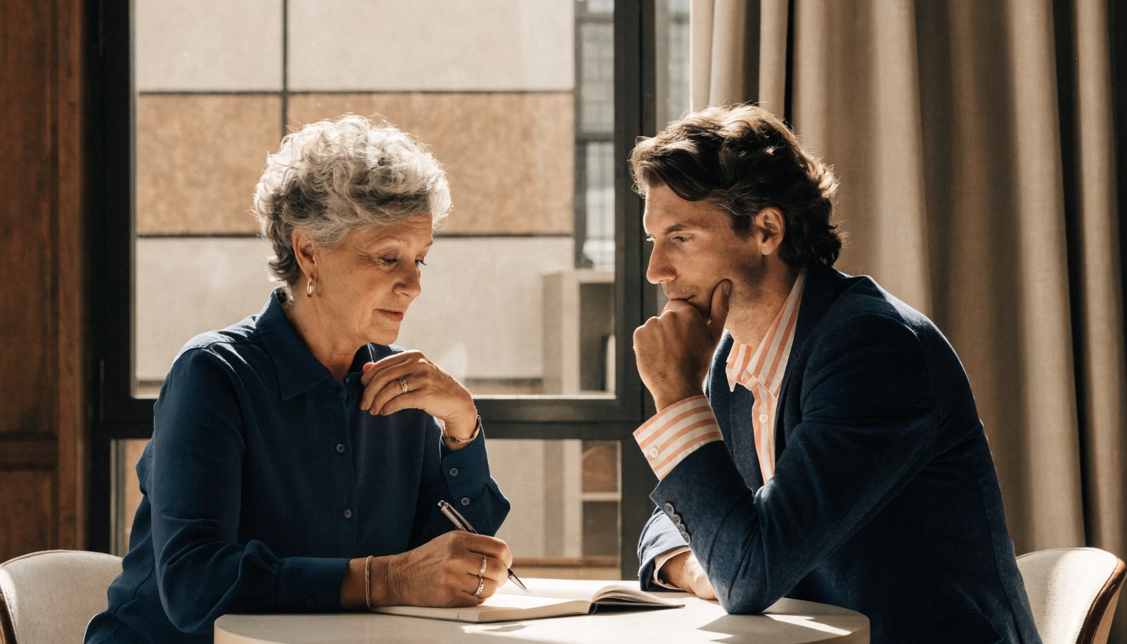 An experienced adviser and manager reviewing a development plan.