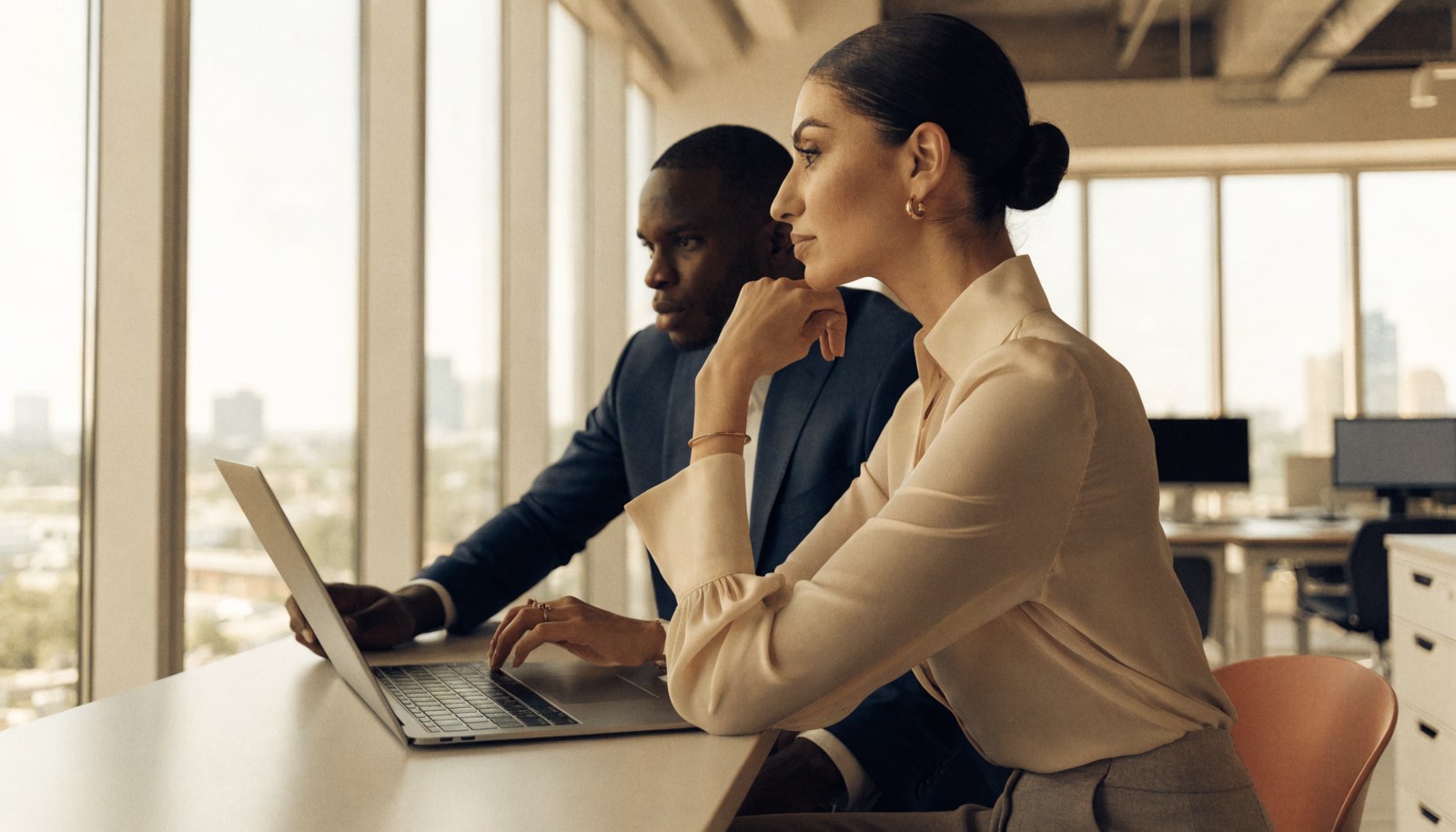 A business leader reviewing work with an adviser.